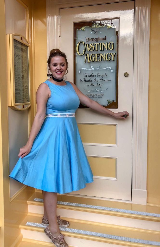 Adults playing dress up at Disneyland by Disneybounding! Adults can wear stylish every day clothes inspired by a Disney character. Here is an example for Disneybounding as Cinderella.