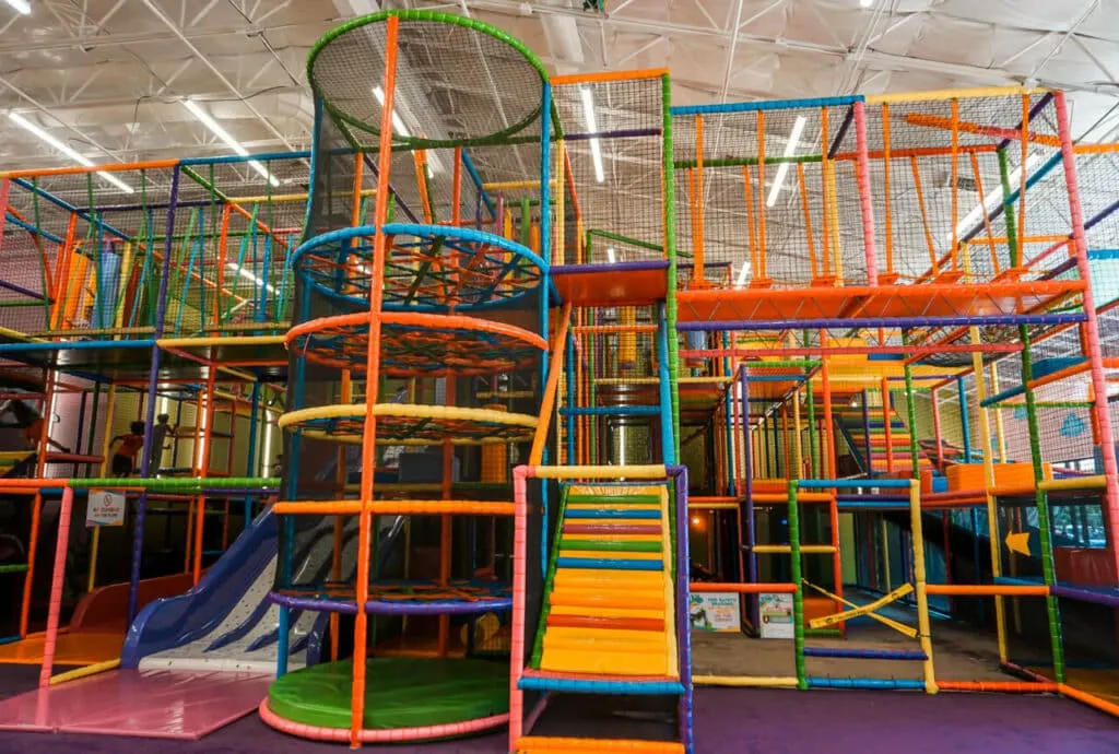 A multi-level colorful indoor playground in Dallas at Kids Empire.
