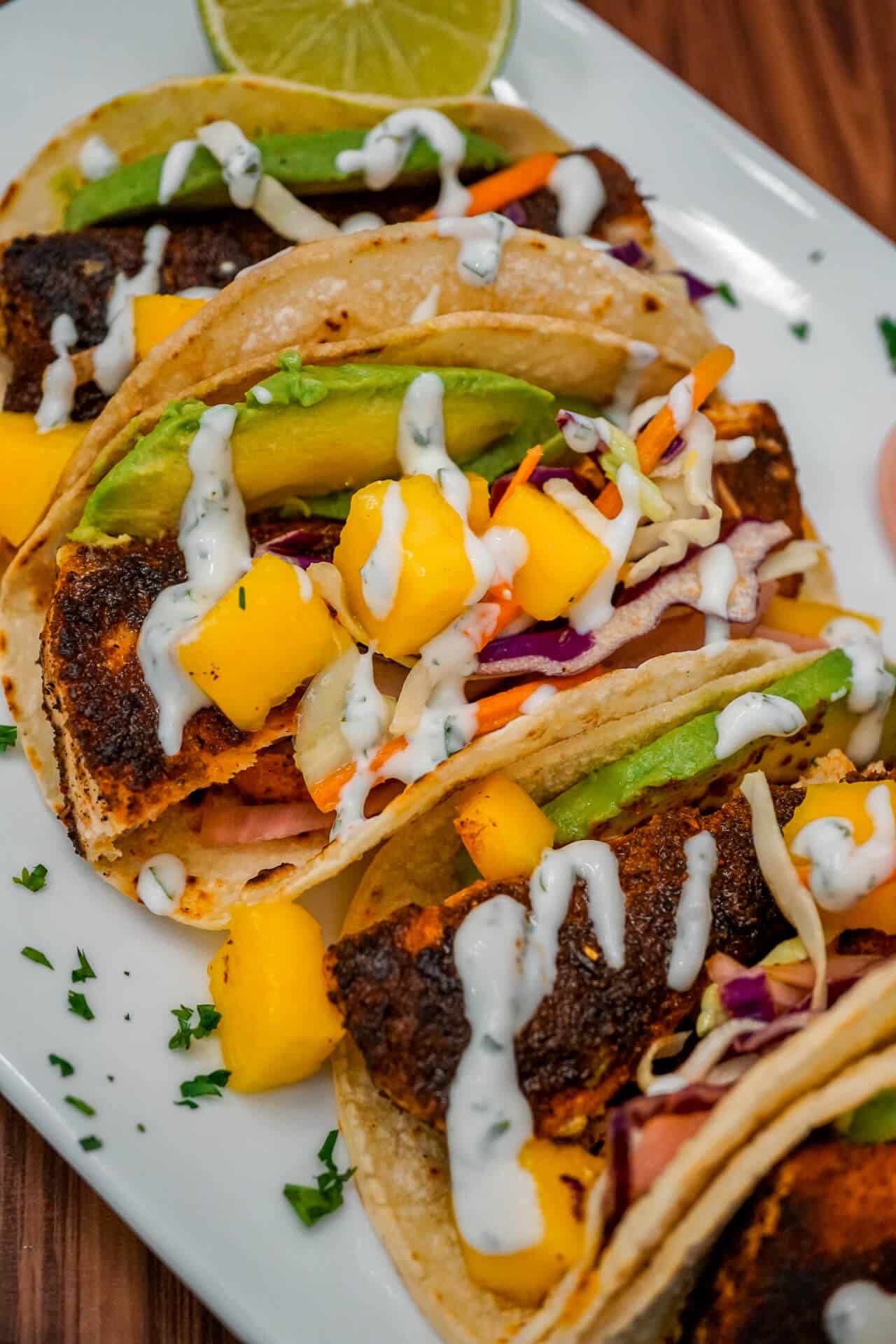 The Ultimate Blackened Fish Tacos with Mango Slaw