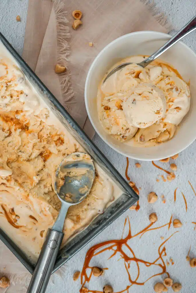 A rectangle pan and bowl of homemade Hazelnuts Salted Caramel Ice Cream.