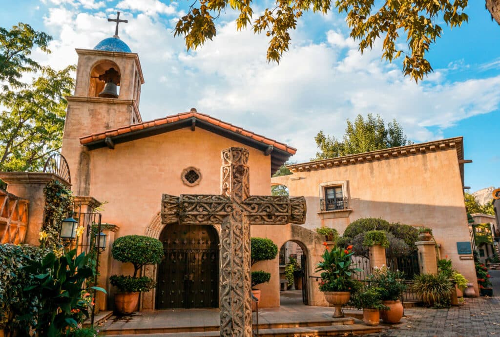 A cross in front of a beautiful church at Tlaquepaque Arts & Shopping Village.  