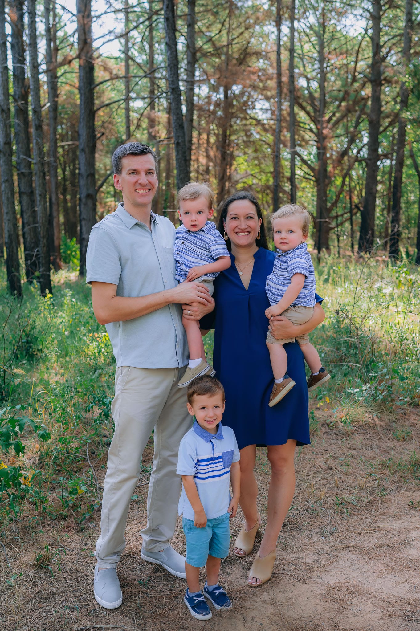 Family picture of Adam, Christina, Nathaniel, Nicholas, and Noah dressed in shades of blue.